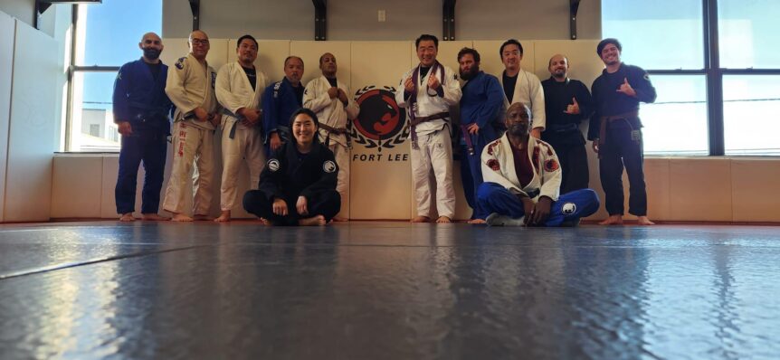 Brazilian jiu-jitsu training team at Fort Lee academy demonstrating martial arts community and safe training practices for injury prevention